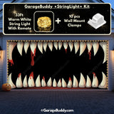Monster teeth Halloween garage door cover on a double-door garage, featuring glowing lights and a spooky design of a haunted girl for a chilling Halloween display